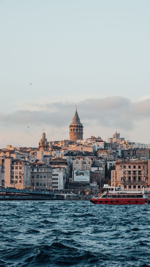 Free Breathtaking view of Galata Tower and Istanbul skyline with the Bosphorus in the foreground. Stock Photo