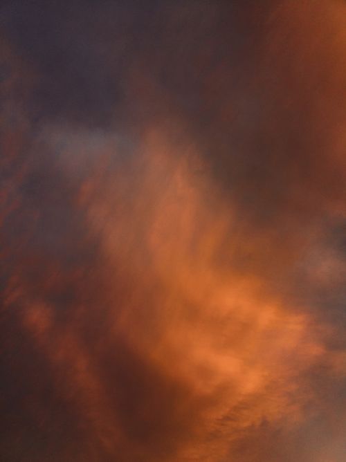 Free Dramatic sunset clouds with rich orange hues over Brazil's sky. Stock Photo