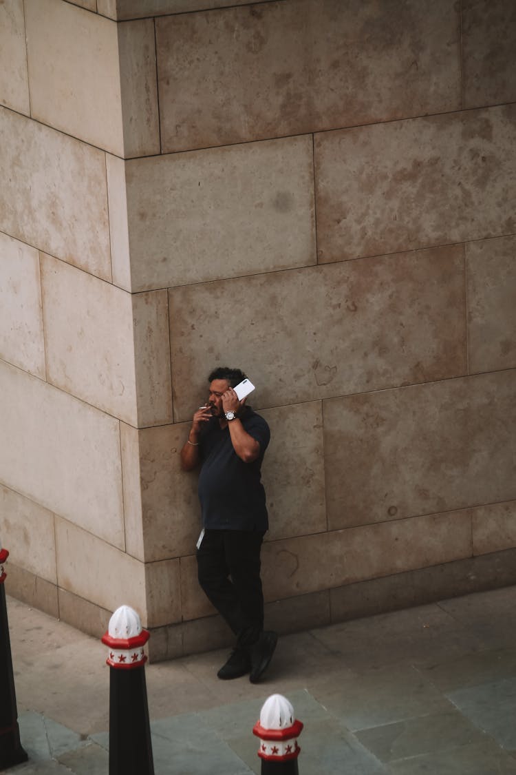 Man Talking On A Phone On A Street