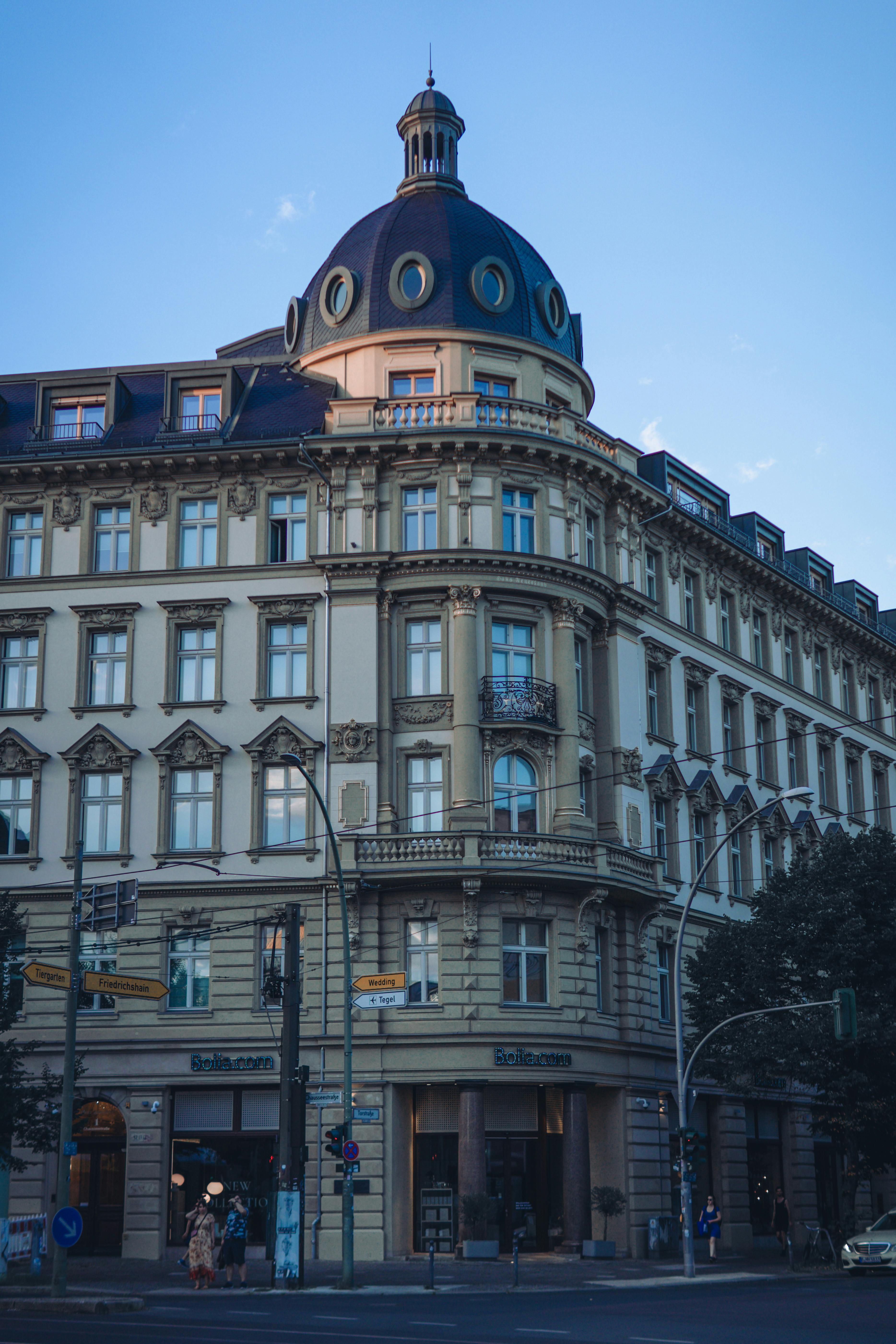 Free Classic architecture with a dome in Berlin city street corner during daytime. Stock Photo