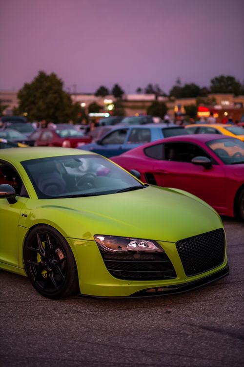 Free Bright green supercar on display at an urban car meet during dusk. Stock Photo