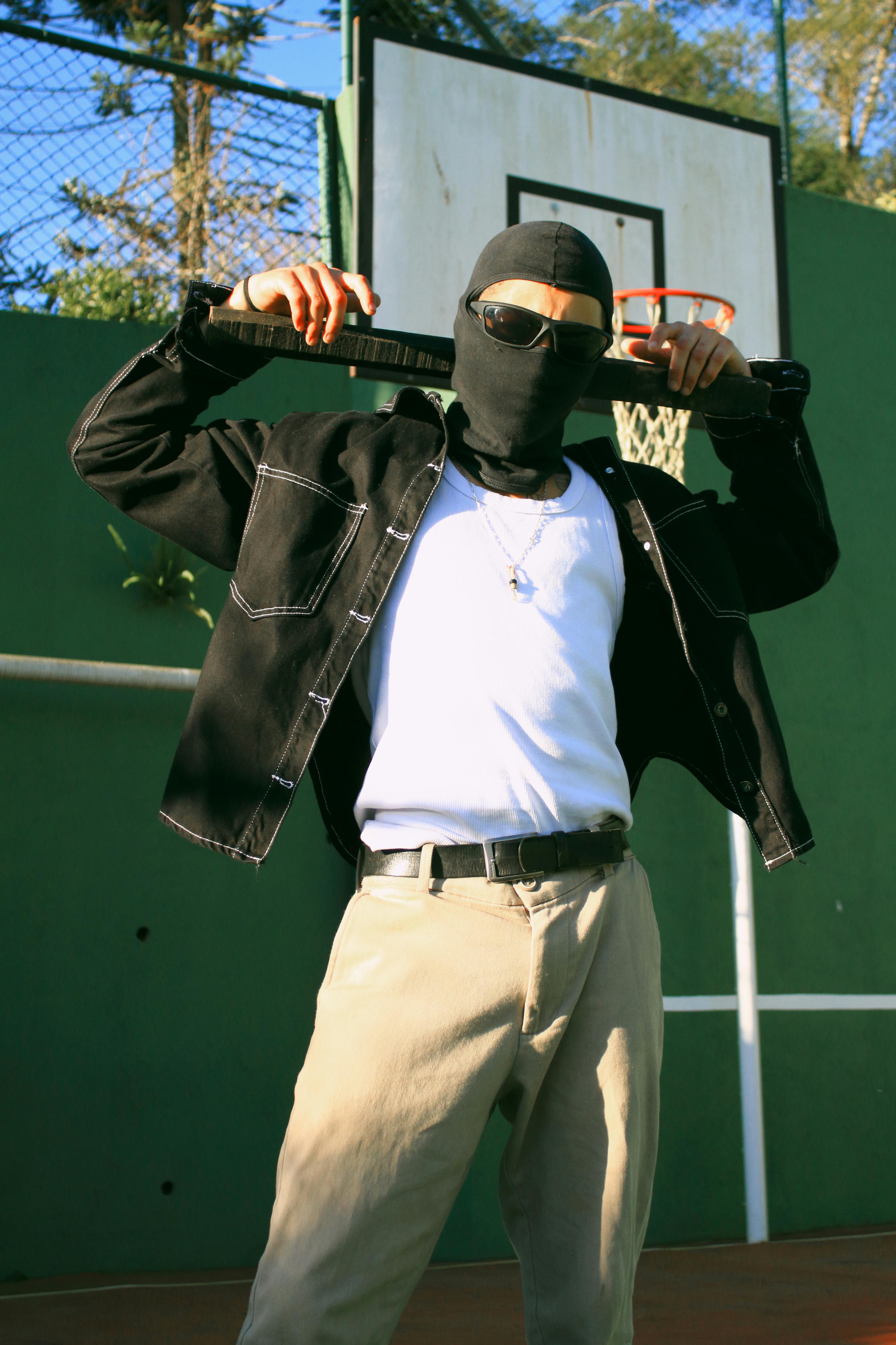 man in balaclava and sunglasses