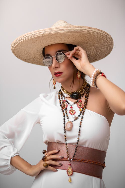Woman in a Hat, Sunglasses and a Dress