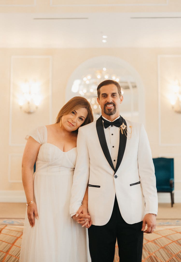 Smiling Newlyweds Holding Hands