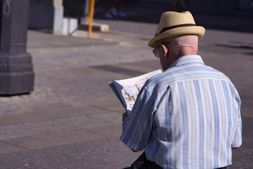 man reading newspaper