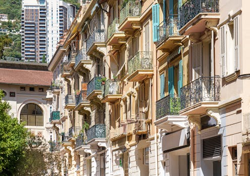Elegant cityscape of Monaco with sunlit balconies, embodying urban charm.