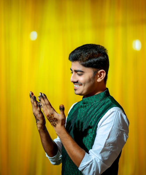 Smiling Man with Henna Tattoos