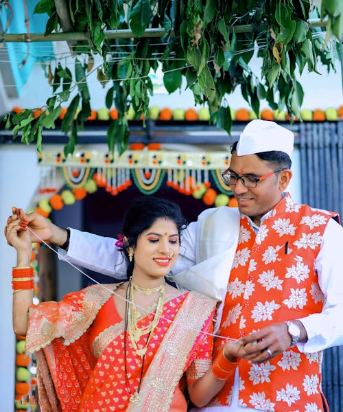 Smiling Newlyweds in Traditional Clothing