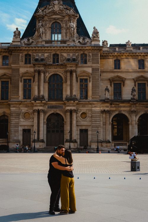 Couple Hugging near Louvre Building in Paris · Free Stock Photo