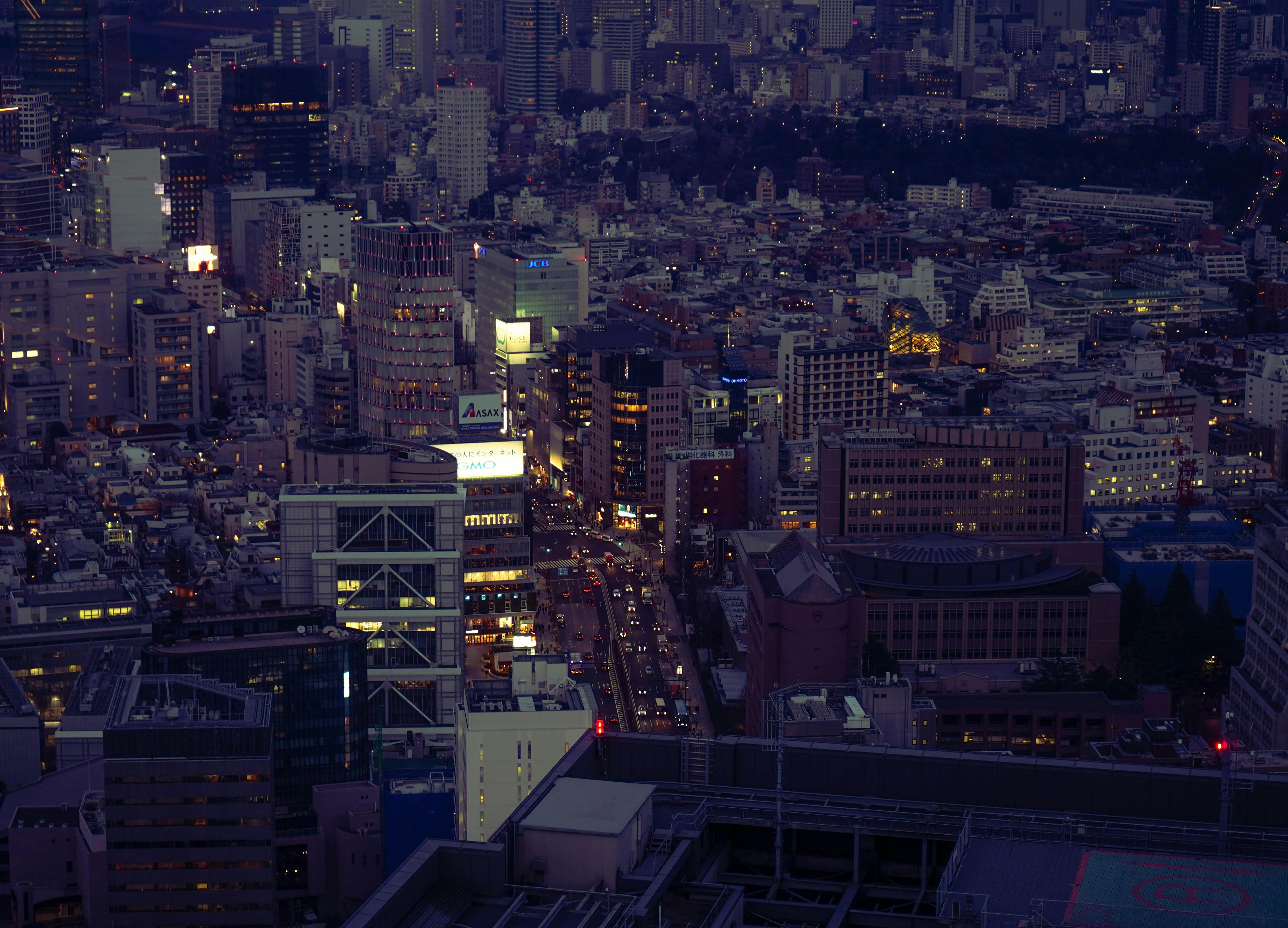 Captivating aerial view of Shibuya City, Tokyo at night showcasing the bustling urban landscape and vibrant skyline.