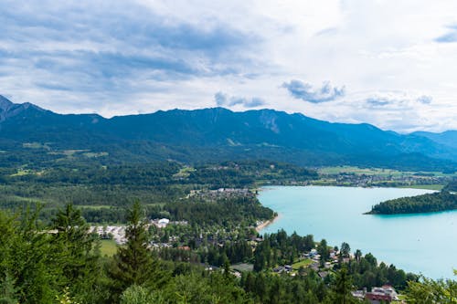 A view of a lake and mountains from a hill