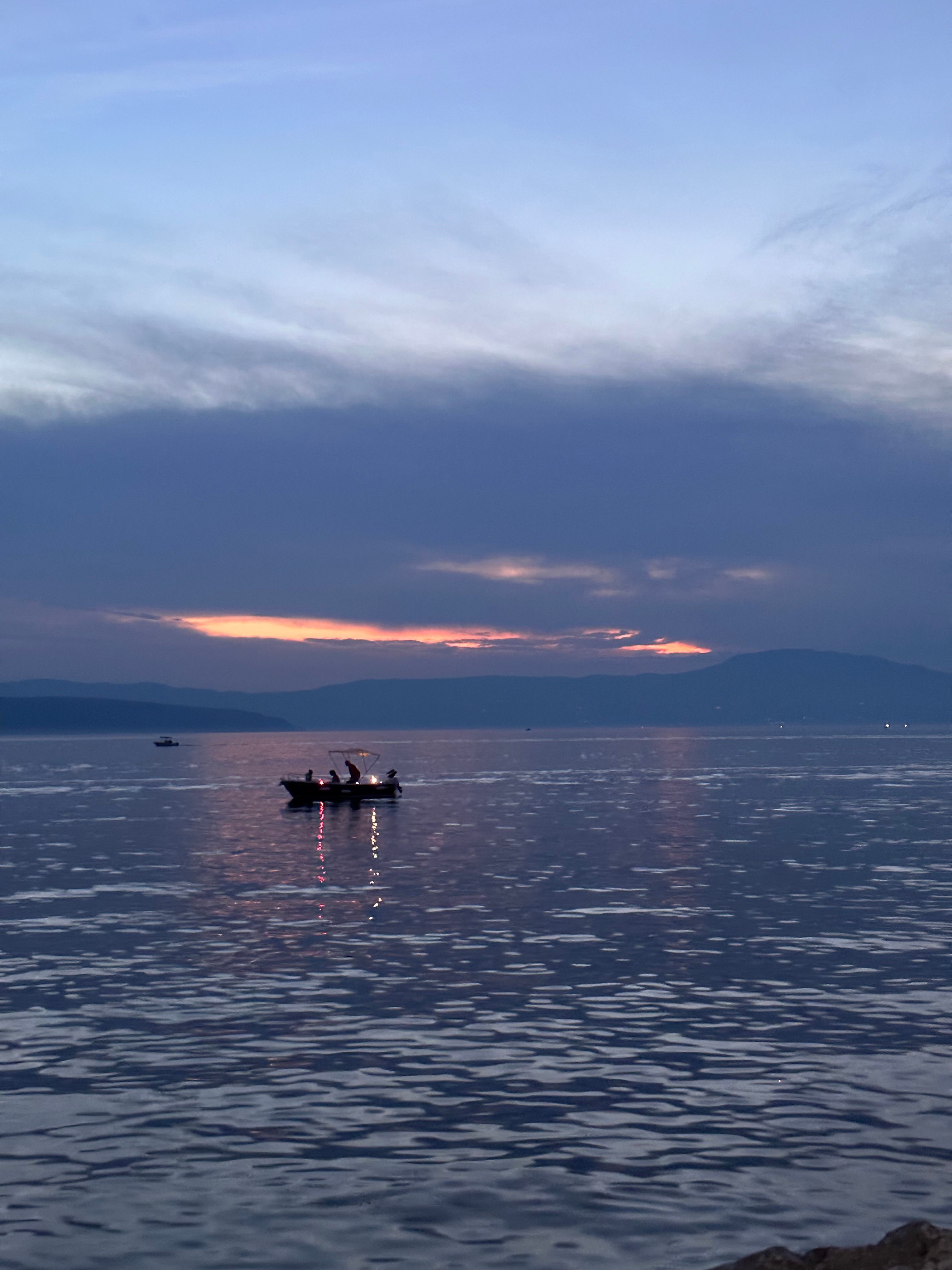 People on Motorboat on Lake at Sunset · Free Stock Photo
