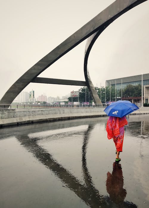 A Woman with an Umbrella in City 