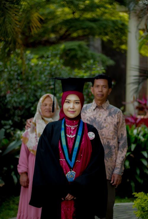 Free Graduation ceremony with proud parents in Malang, Indonesia. Stock Photo