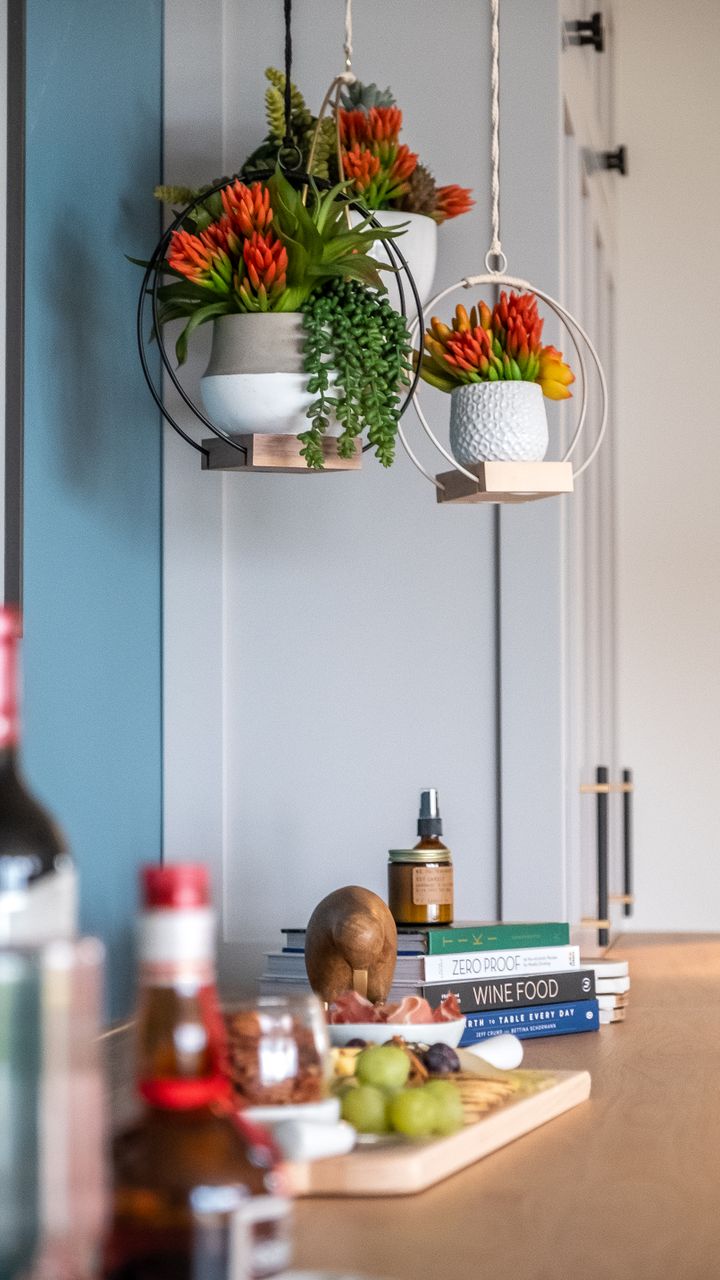 Small faux succulent plants in ceramic pots displayed on a dollar tree coffee bar design
