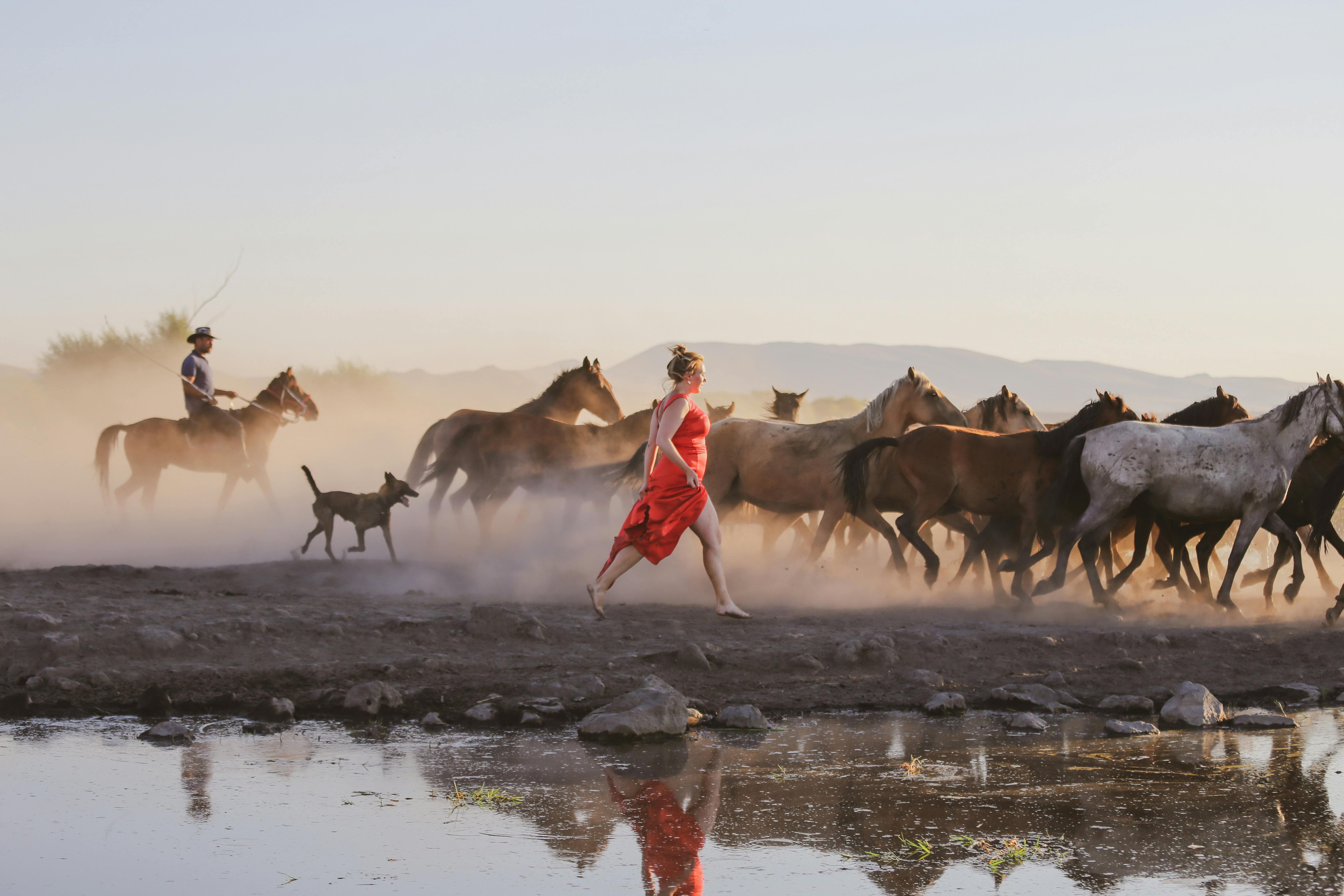 Woman in red dress running