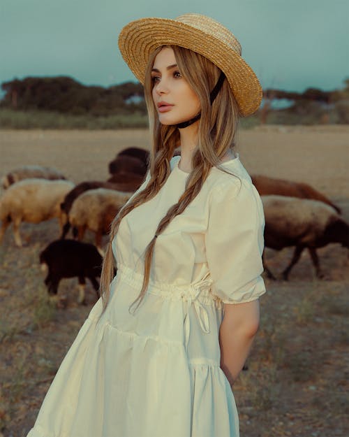 Model in White Dress Posing in Pasture
