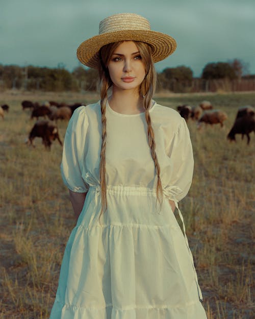 Blonde in Straw Hat and White Dress