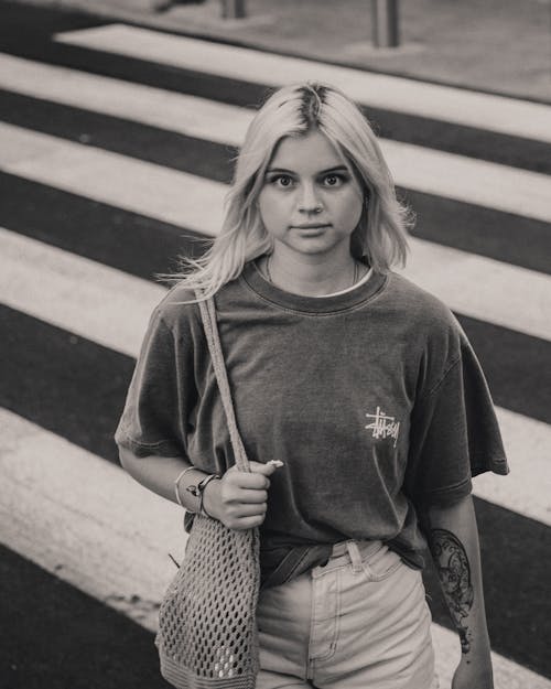 Standing on Crosswalk Woman Holding Mesh Bag on Shoulder