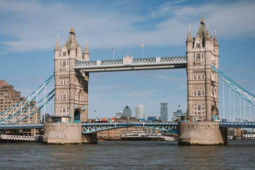 Free Stunning view of Tower Bridge and skyscrapers against a clear London sky. Stock Photo