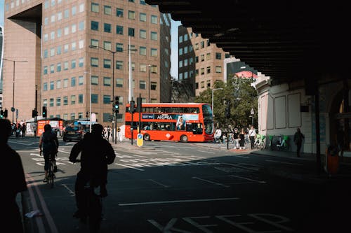 Red London Bus Running on Street