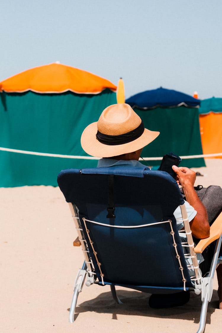 Man Relaxing On Beach