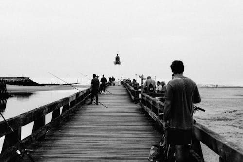 Free Anglers on Pier in Seaside Stock Photo