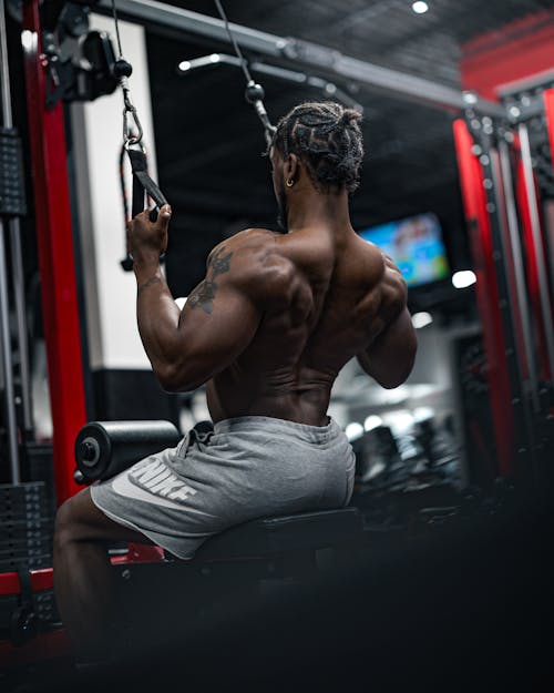 Shirtless Man Exercising at Gym