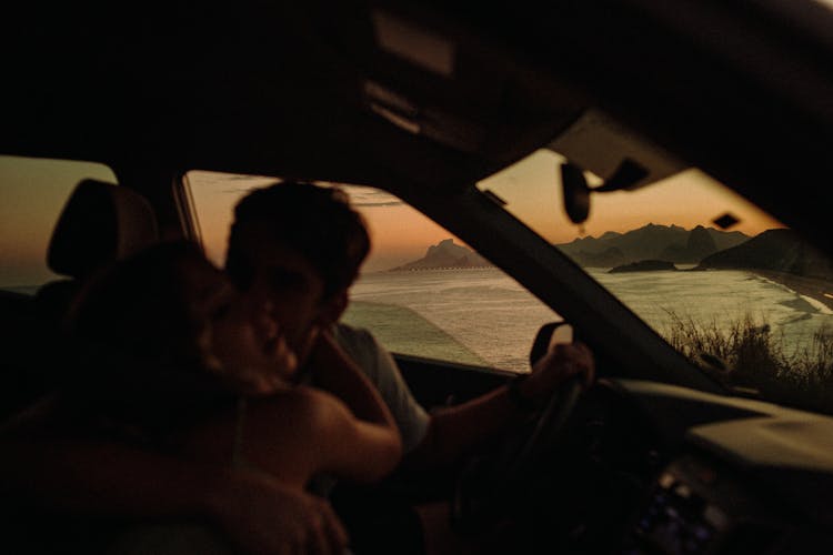 Affectionate Couple In Car 