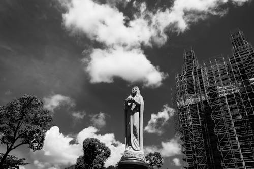 Holy Mary Statue and Scaffolding over Building behind
