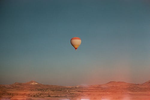Hot Air Balloon Flying under Clear Sky
