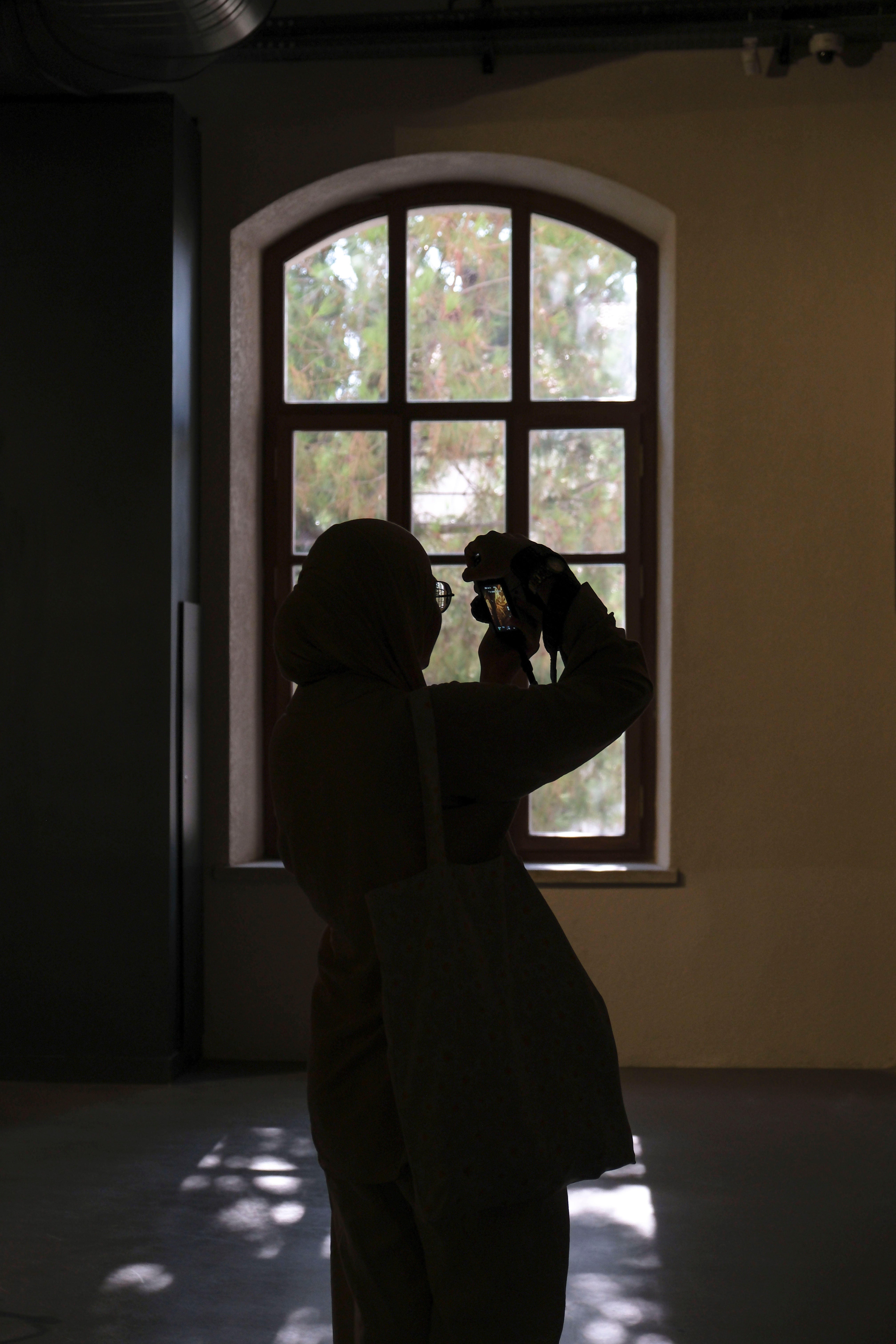 Photographer Taking Photo of Window in Building · Free Stock Photo