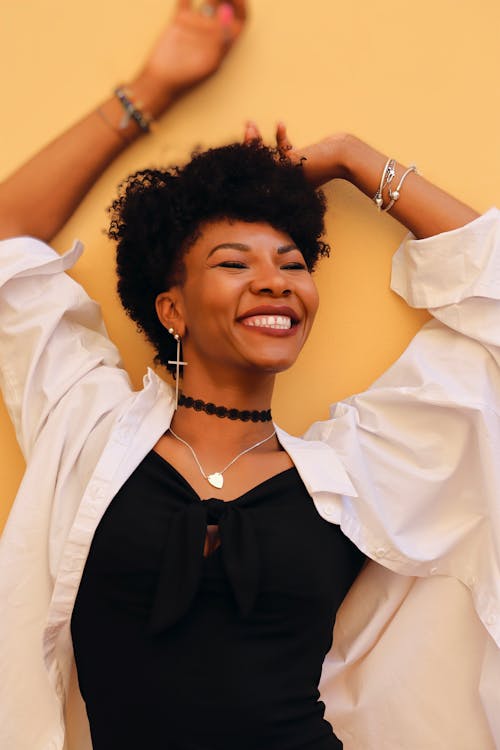 Smiling Woman in White Shirt