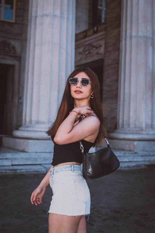Woman in Sunglasses and with Bag
