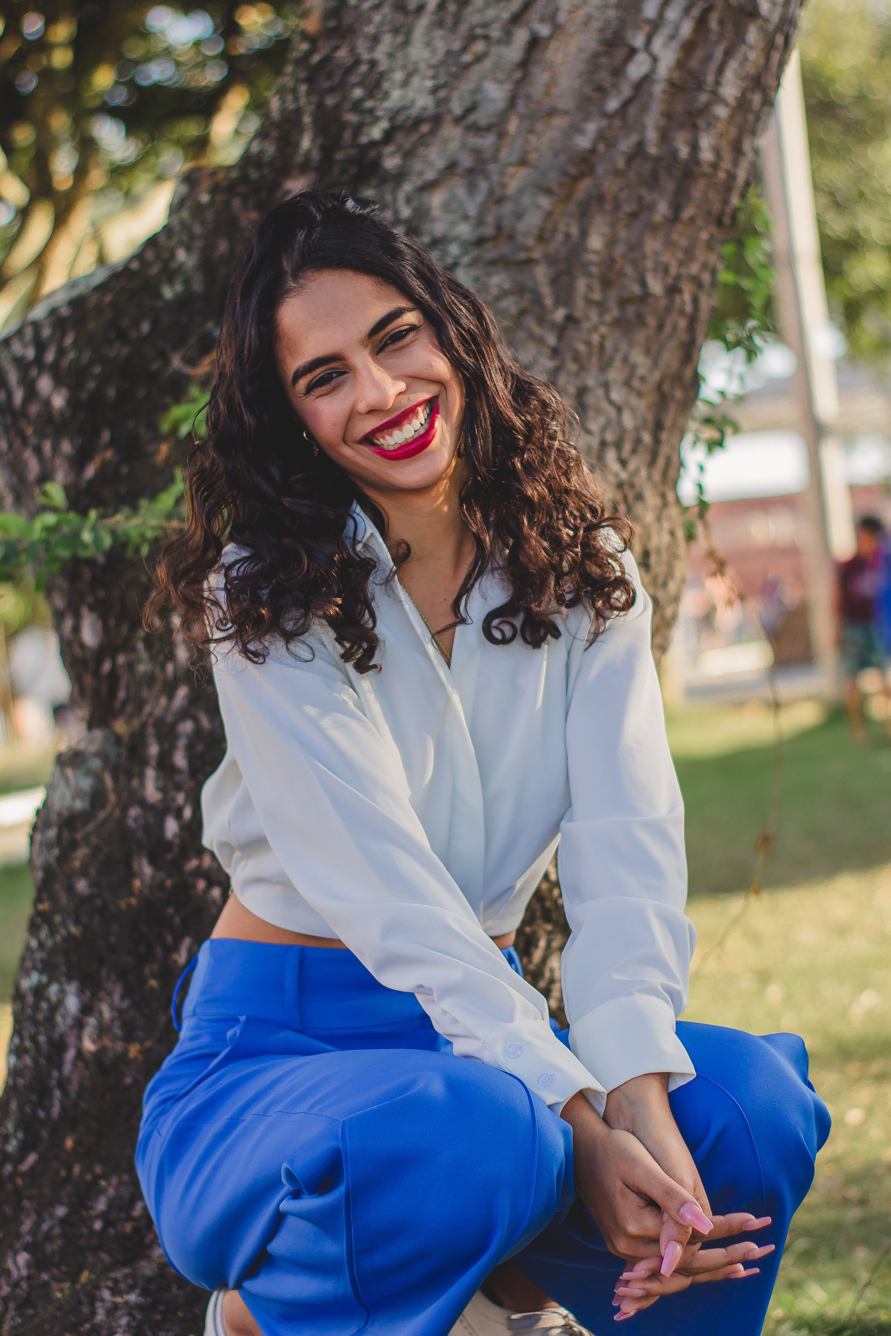 Young Woman Posing next to a Tree · Free Stock Photo