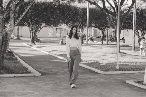 Young Fashionable Woman Walking in the Park 