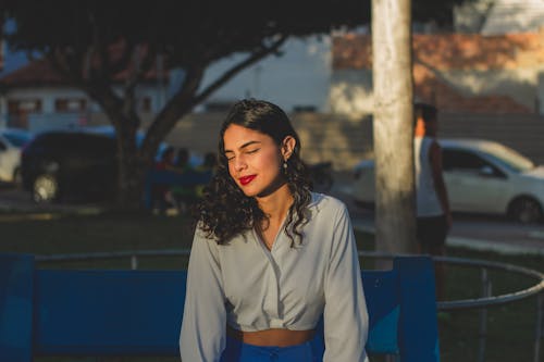 Portrait of a Woman Sitting Outdoors