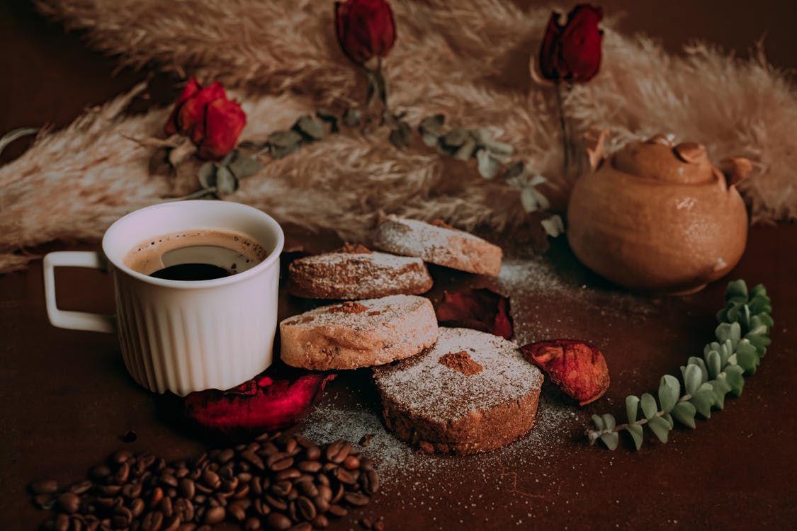 A Coffee and Cookies on a Table