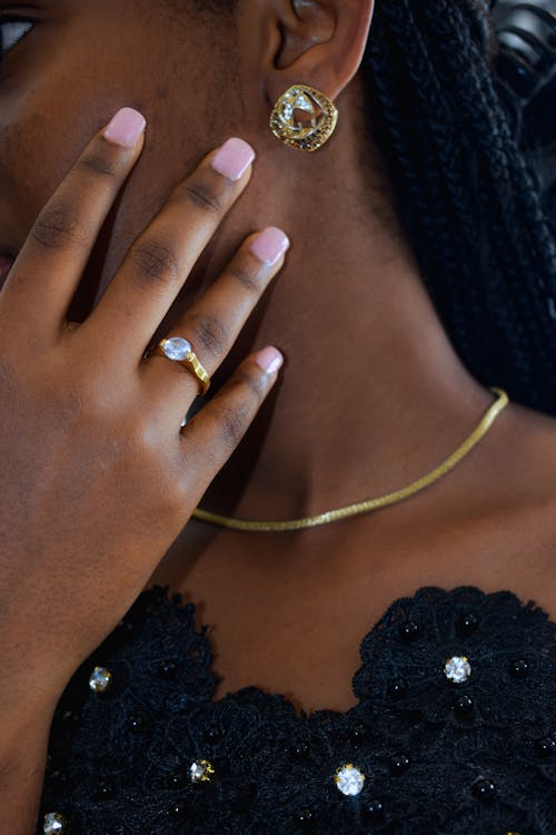 Woman Hand with Ring on Neck