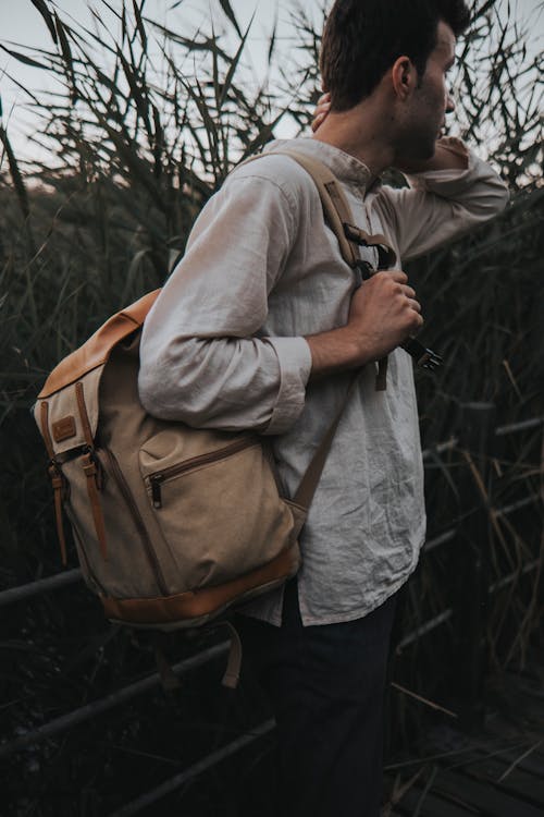 Man With a Backpack in a Forest