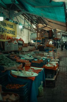 Vibrant market stall in Bursa, Turkey showcasing an array of fresh produce under colorful tarps.. pexels, vibrant, market