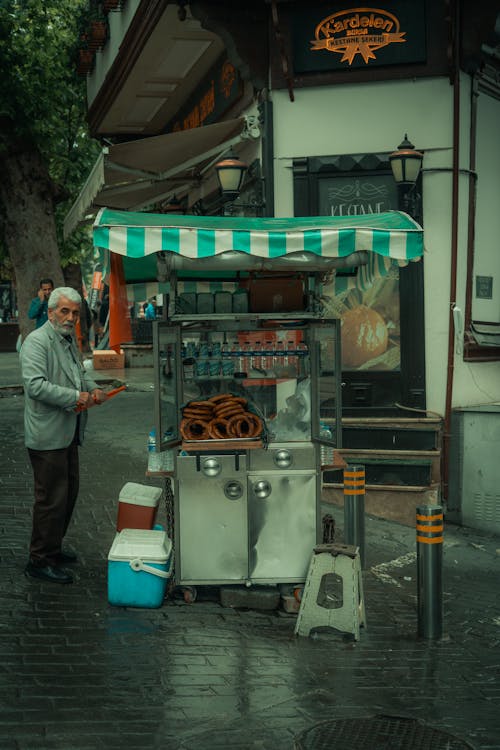 Man Selling Food on a Street