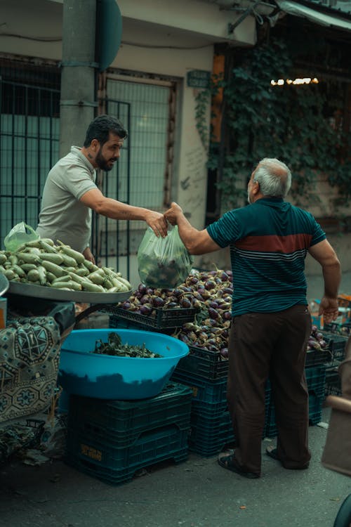 Man Selling Vegetables on a Street