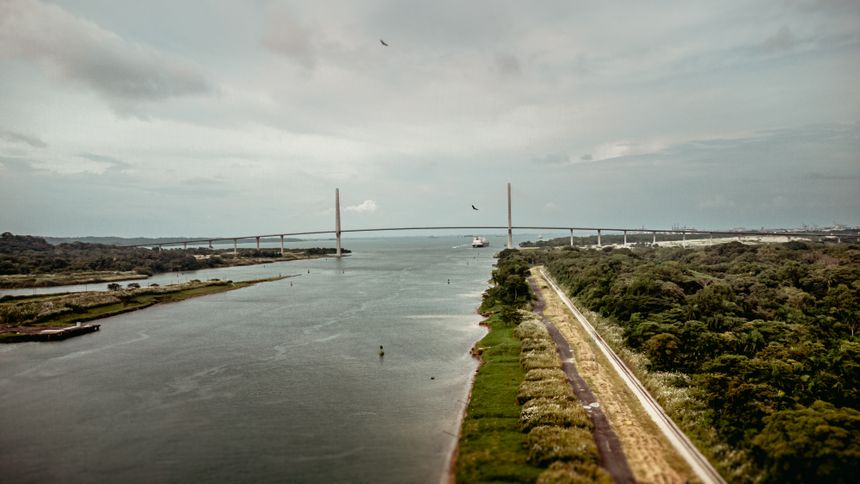 Cable-stayed road bridge crossing a wide estuary under grey cloud, ZaetaFlow Sec on Pexels