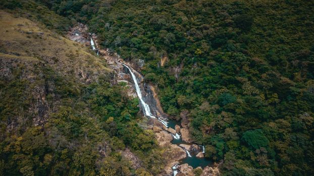 Stunning aerial shot of a waterfall nestled in the lush forest of El Cano, Coclé Province, Panama.
