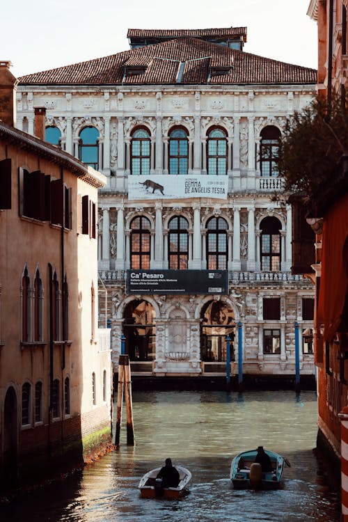 View of Gondolas on the Canal near the Ca Pesaro Building in Venice, Italy