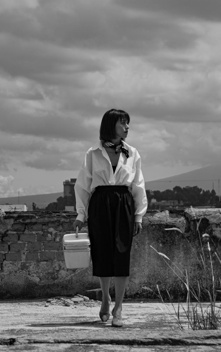 Young Elegant Woman Walking Outside 