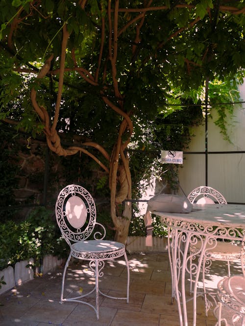 White Metal Garden Furniture Under the Gazebo