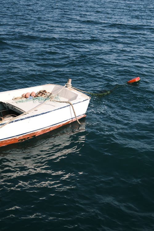 Empty Boat Floating on Water