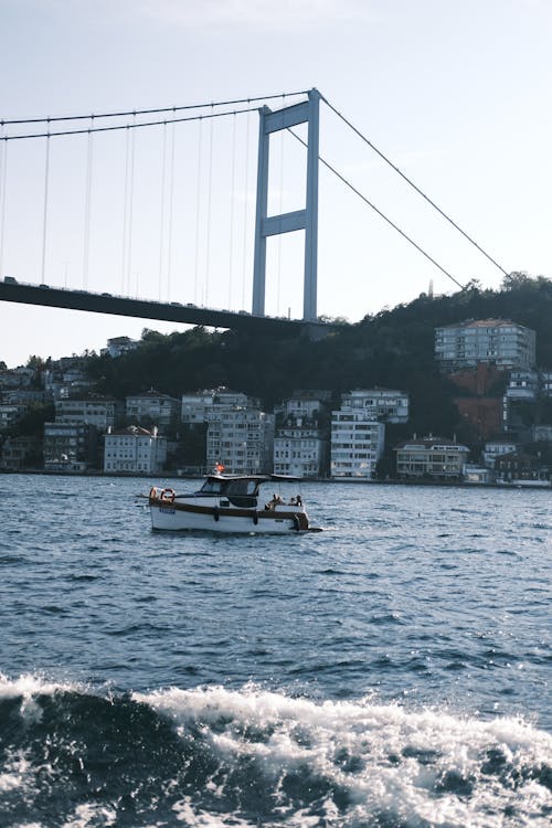 Boat Sailing against Fatih Sultan Mehmet Bridge in Istanbul